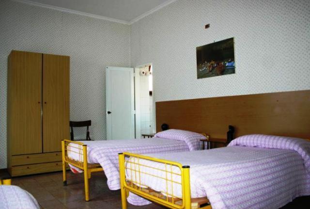 Postel nebo postele na pokoji v ubytování Albergo Anna
