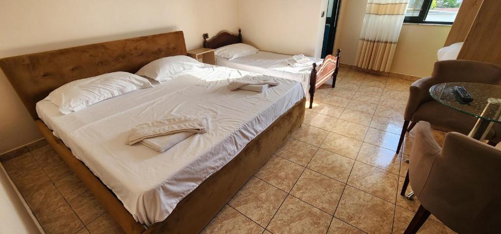 Postel nebo postele na pokoji v ubytování Hotel La Villa