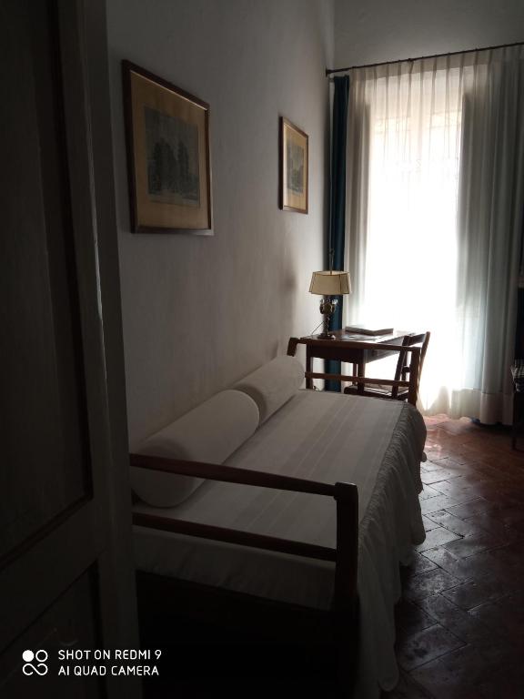 Posteľ alebo postele v izbe v ubytovaní Relais Sassetti