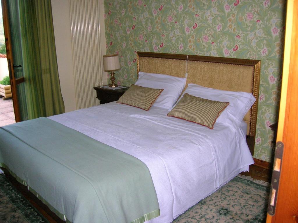 Postel nebo postele na pokoji v ubytování B&B Il Suono del Bosco