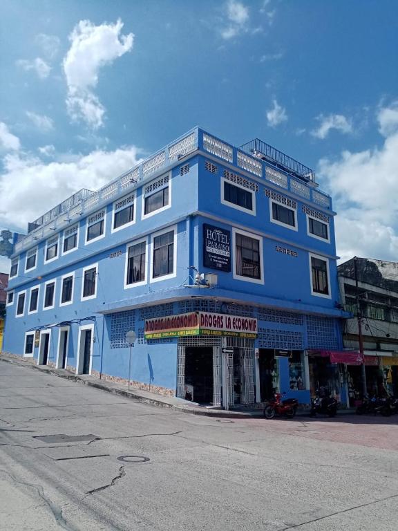 a blue building on the side of a street at Hotel Iguana Azul in Honda