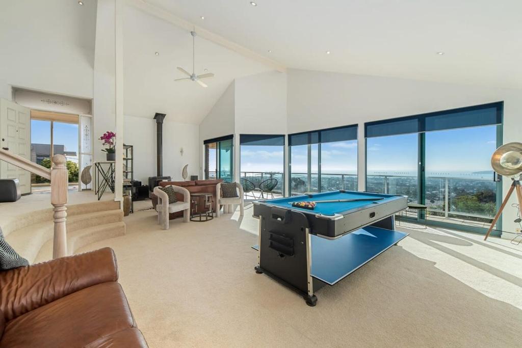 a living room with a pool table in it at Dromana Premium Retreat - Stunning views in Dromana
