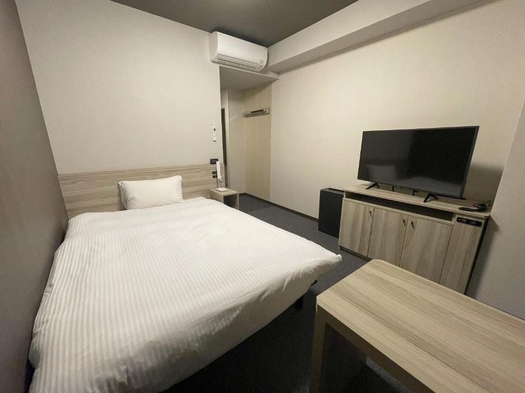 TV a/nebo společenská místnost v ubytování Hotel Route Inn Numata