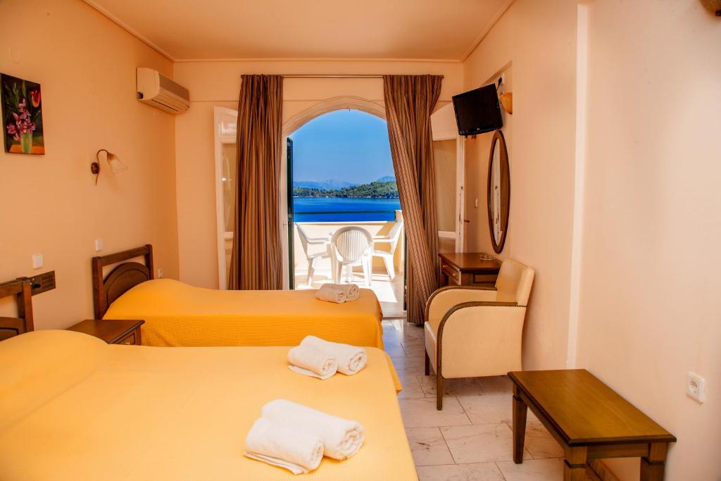 Postel nebo postele na pokoji v ubytování Hotel Niras