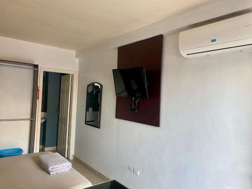 TV a/nebo společenská místnost v ubytování Suite Noa Apartamento