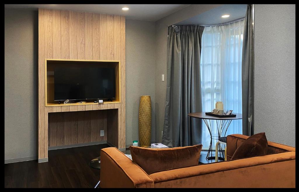 TV a/nebo společenská místnost v ubytování Rong Hua Grand Hotel 榮華グランドホテル