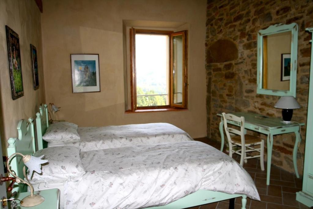 Posteľ alebo postele v izbe v ubytovaní SacreTerre B&B e Agriturismo