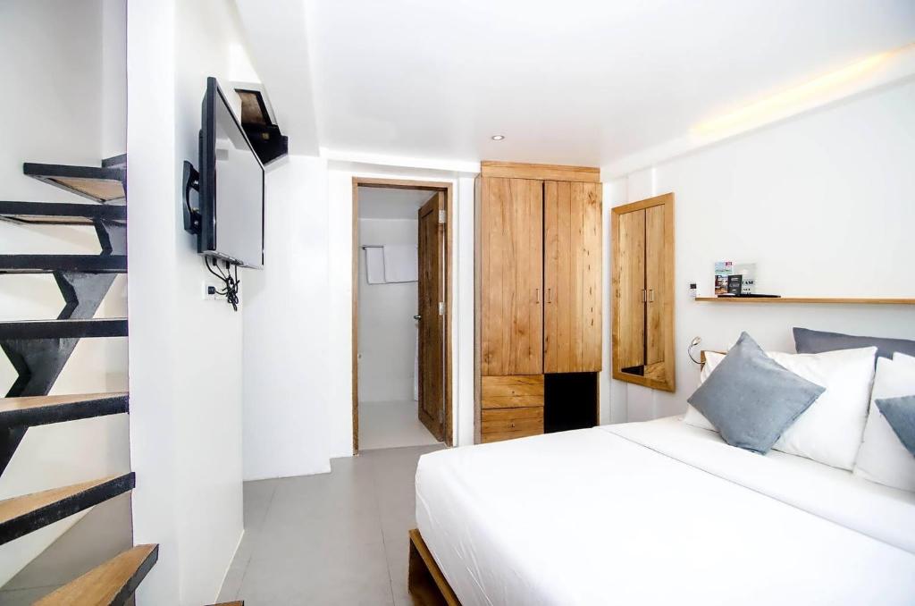 Postel nebo postele na pokoji v ubytování Zuzuni Boutique Hotel