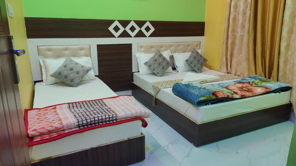 מיטה או מיטות בחדר ב-Pari home Stay