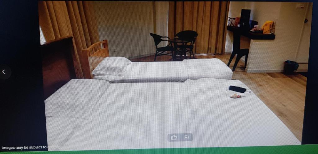 Postel nebo postele na pokoji v ubytování Homestay KNK