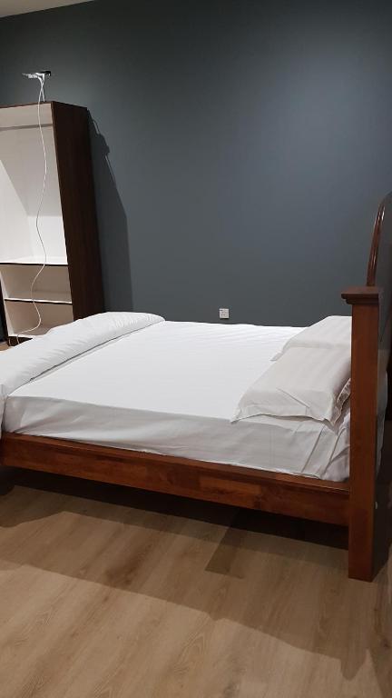 Postel nebo postele na pokoji v ubytování Homestay KNK