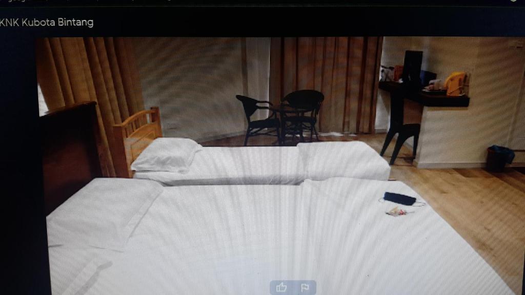 Postel nebo postele na pokoji v ubytování Homestay KNK