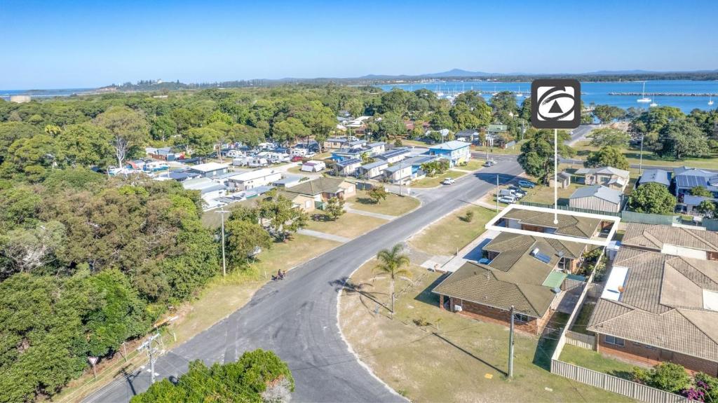 an aerial view of a residential neighbourhood with houses at Waratah in Iluka