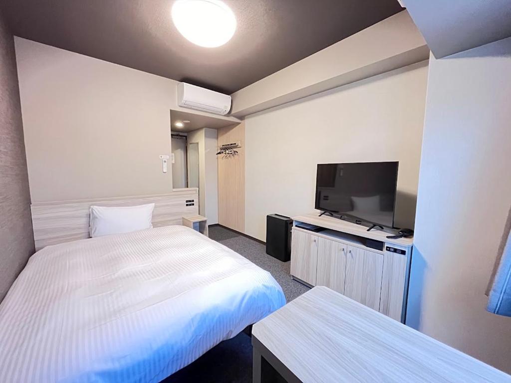 TV a/nebo společenská místnost v ubytování Hotel Route Inn Kuwana