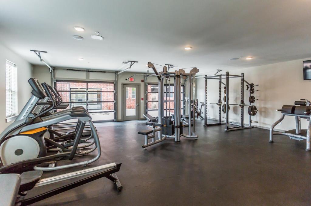 a gym with several treadmills and cardio machines at Sleepover 1BD 1BA Little Rock Apartments in North Little Rock