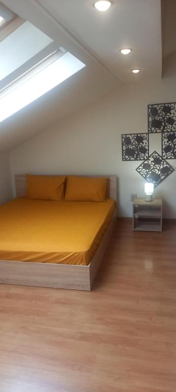 a bedroom with a bed in a attic at Бижу в сърцето на Варна in Varna City