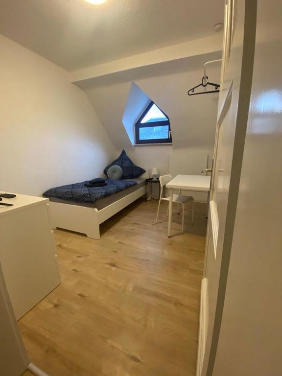 Postel nebo postele na pokoji v ubytování Charmante Wohnungen direkt in der Stadtmitte