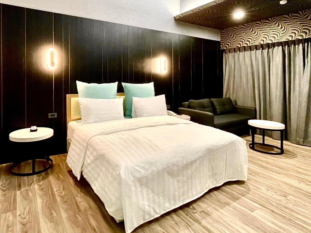Postel nebo postele na pokoji v ubytování Yi MOTEL