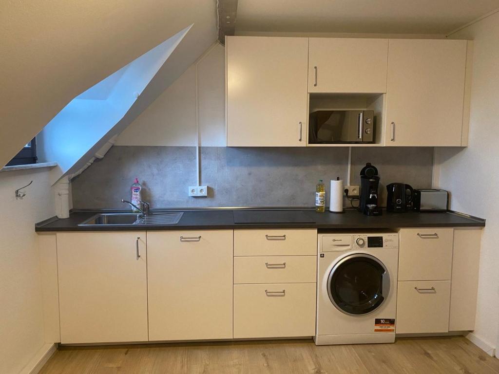 Kuchyň nebo kuchyňský kout v ubytování Charmante Wohnungen direkt in der Stadtmitte