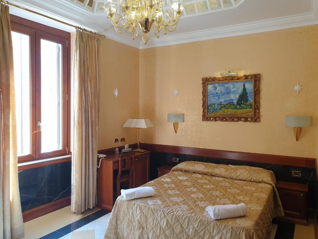 Postel nebo postele na pokoji v ubytování Hotel Bolivar