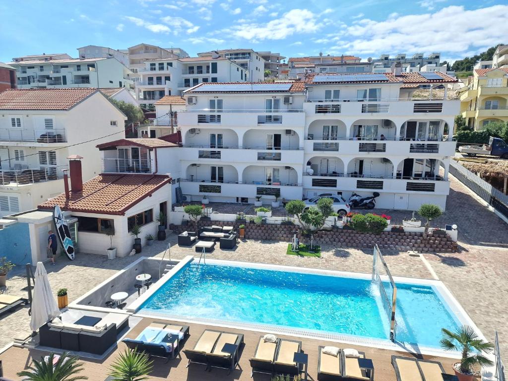 an aerial view of a hotel with a swimming pool at Apartments Silva in Trogir