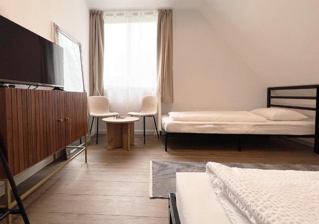 Postel nebo postele na pokoji v ubytování Nussbaum Panzió