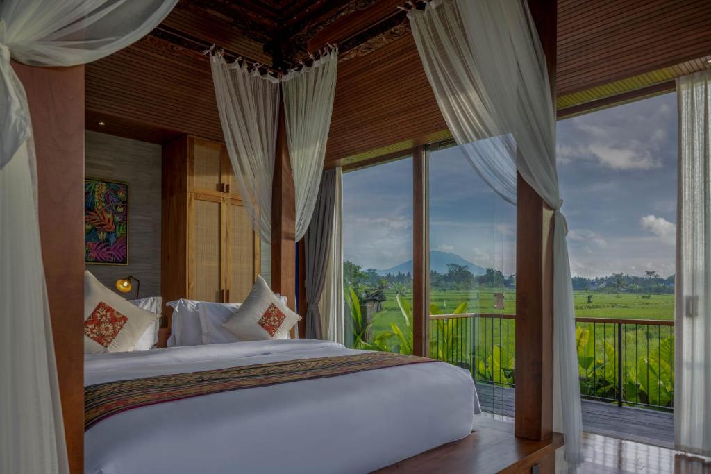 Postel nebo postele na pokoji v ubytování Gdas Bali Health and Wellness Resort - Adult Only