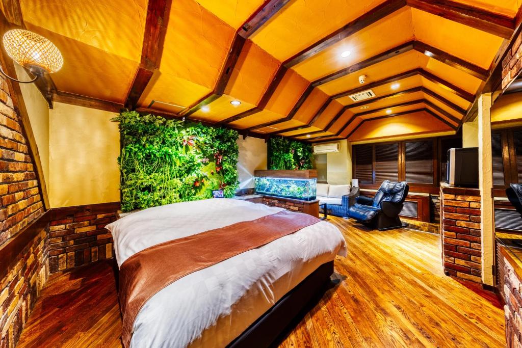 Postel nebo postele na pokoji v ubytování Hotel Lotus Ibaraki -Adult Only