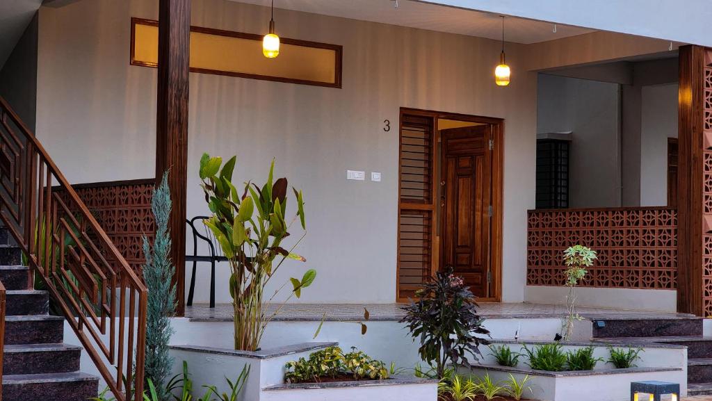 Zahrada ubytování Poojaris Nirantara - Mysuru