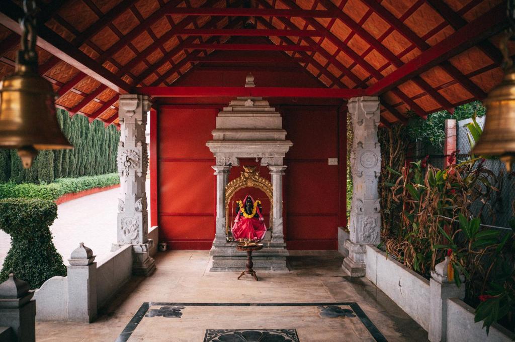 Zahrada ubytování Poojaris Nirantara - Mysuru
