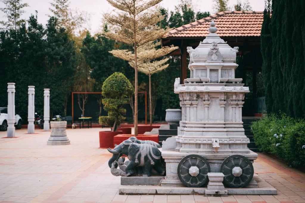 Zahrada ubytování Poojaris Nirantara - Mysuru