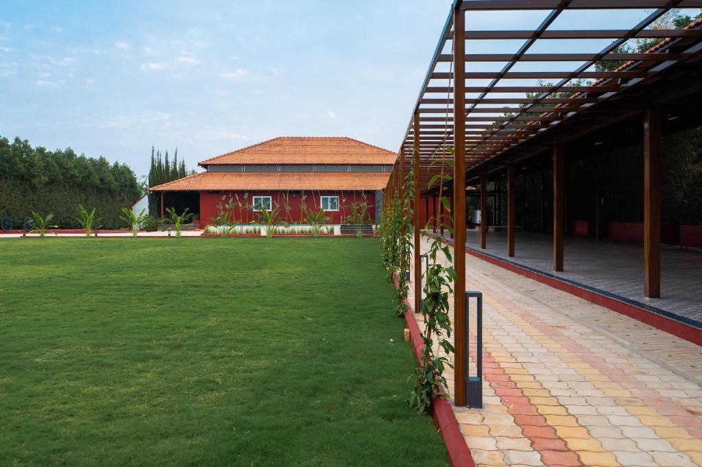 Zahrada ubytování Poojaris Nirantara - Mysuru