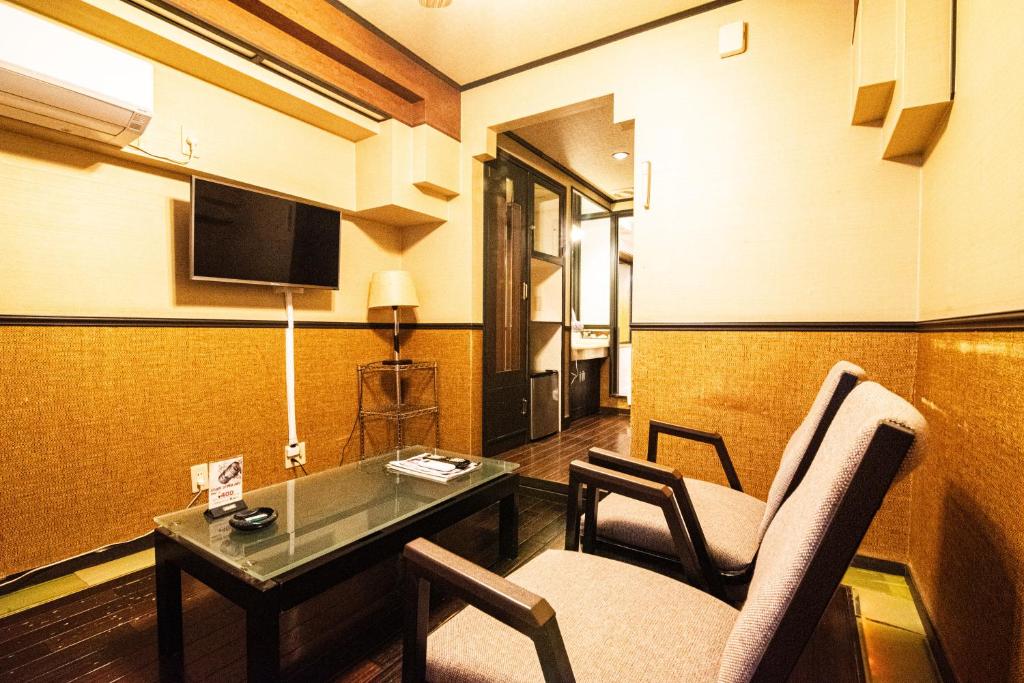 フルスファー ホテルにあるテレビまたはエンターテインメントセンター