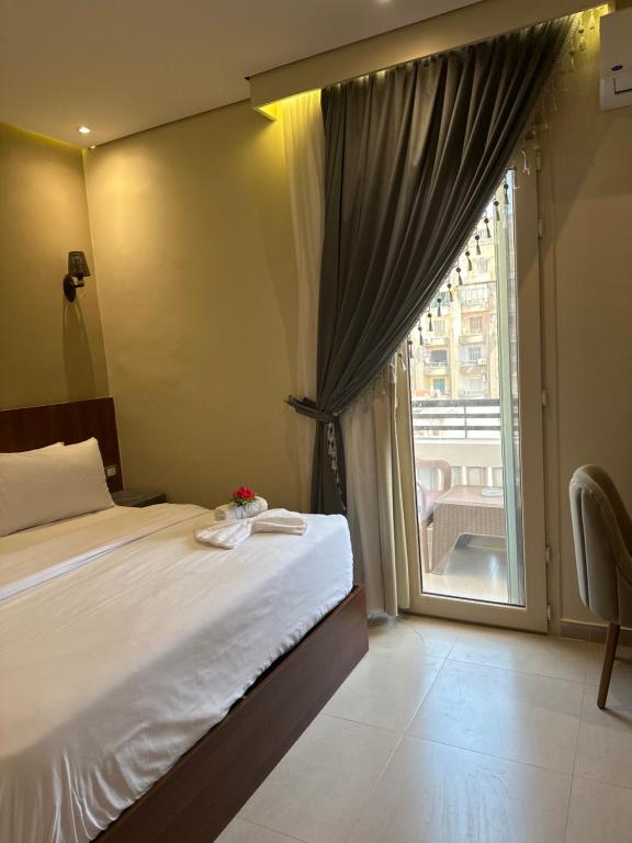 Postel nebo postele na pokoji v ubytování Sama hotel