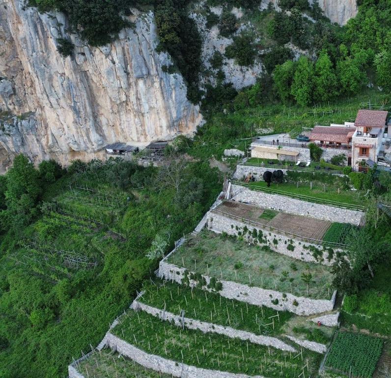 an aerial view of a village in front of a mountain at Agriturismo Orrido di Pino in Agerola