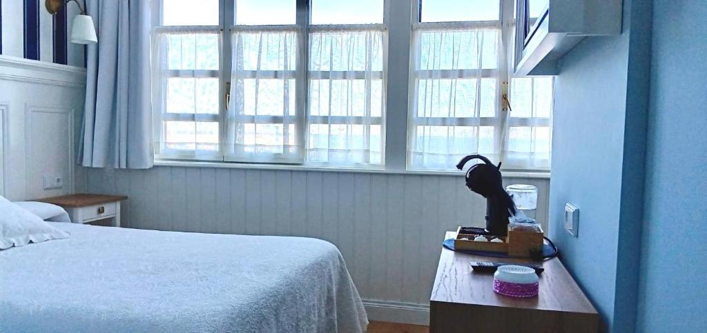 Postel nebo postele na pokoji v ubytování Hotel El Pescador