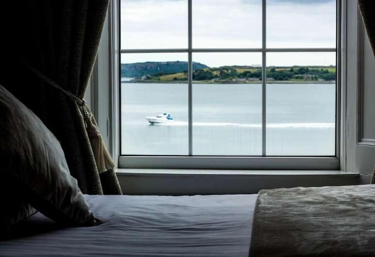 Ένα ή περισσότερα κρεβάτια σε δωμάτιο στο Commodore Hotel