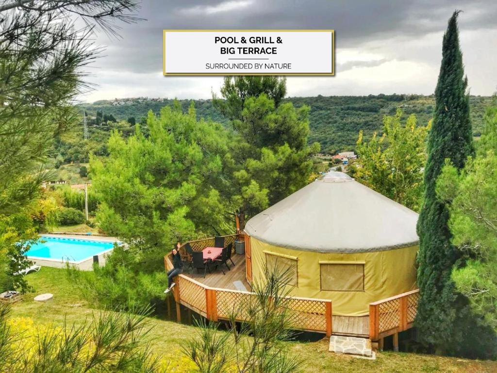 a luxury yurt in a garden with a swimming pool at L.stile Glamping in Portorož
