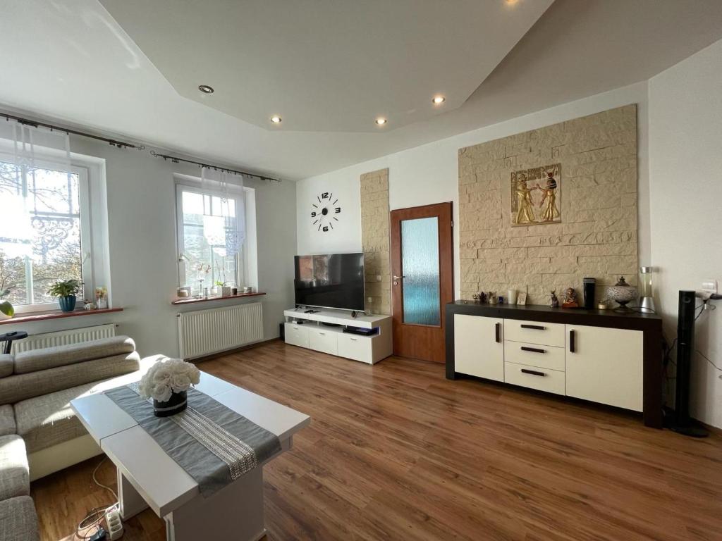 TV a/nebo společenská místnost v ubytování Apartament Muszelka