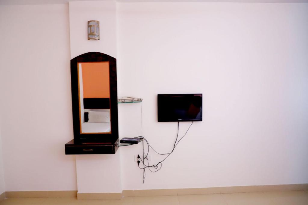 TV a/nebo společenská místnost v ubytování Hotel Sai Kohinoor