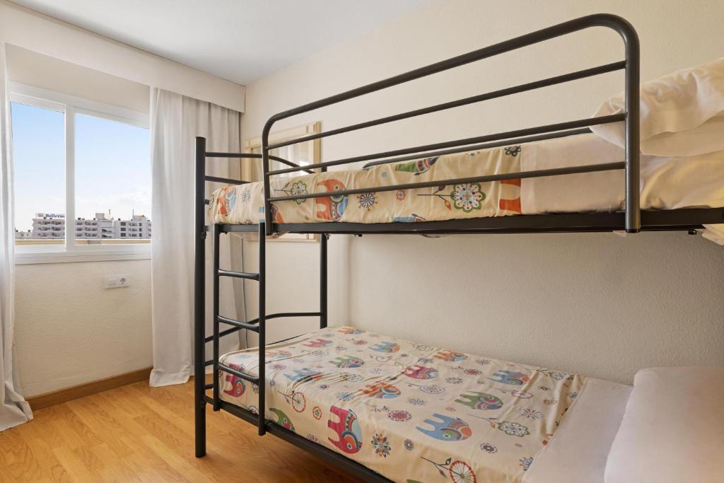 Postel nebo postele na pokoji v ubytování VIVA Sunrise