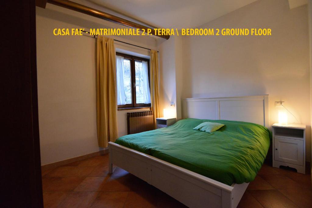 Łóżko lub łóżka w pokoju w obiekcie Casa Faè Dolomiti