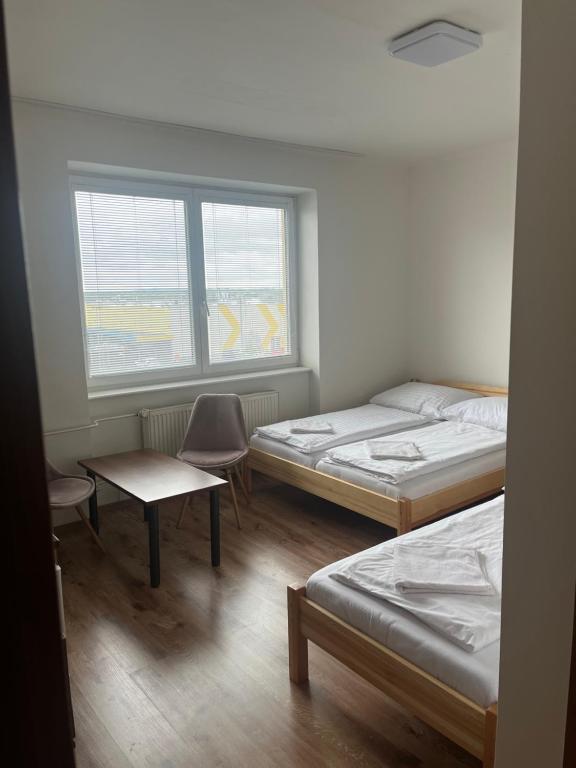 Postel nebo postele na pokoji v ubytování Penzion Znojmo