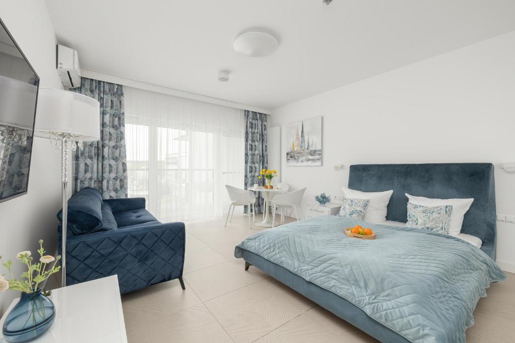 Posteľ alebo postele v izbe v ubytovaní Aquamarina Prima Studio by the BEACH by Noclegi Renters