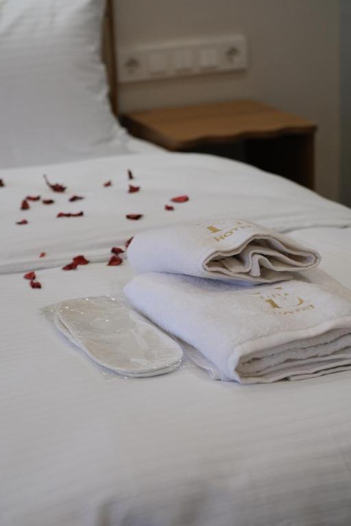 Postel nebo postele na pokoji v ubytování Elita Otel Kumkapı