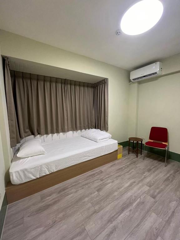 Postel nebo postele na pokoji v ubytování Nobiggie lnn