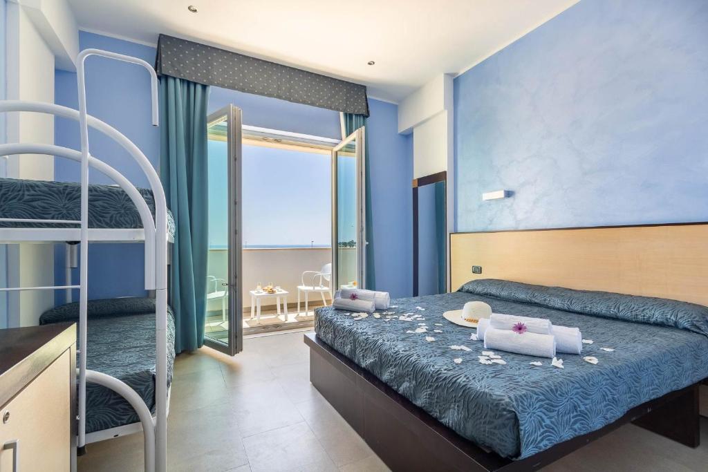 Postel nebo postele na pokoji v ubytování Jonico Hotel