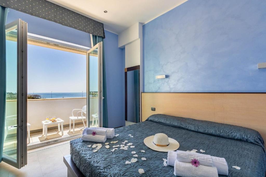 Postel nebo postele na pokoji v ubytování Jonico Hotel