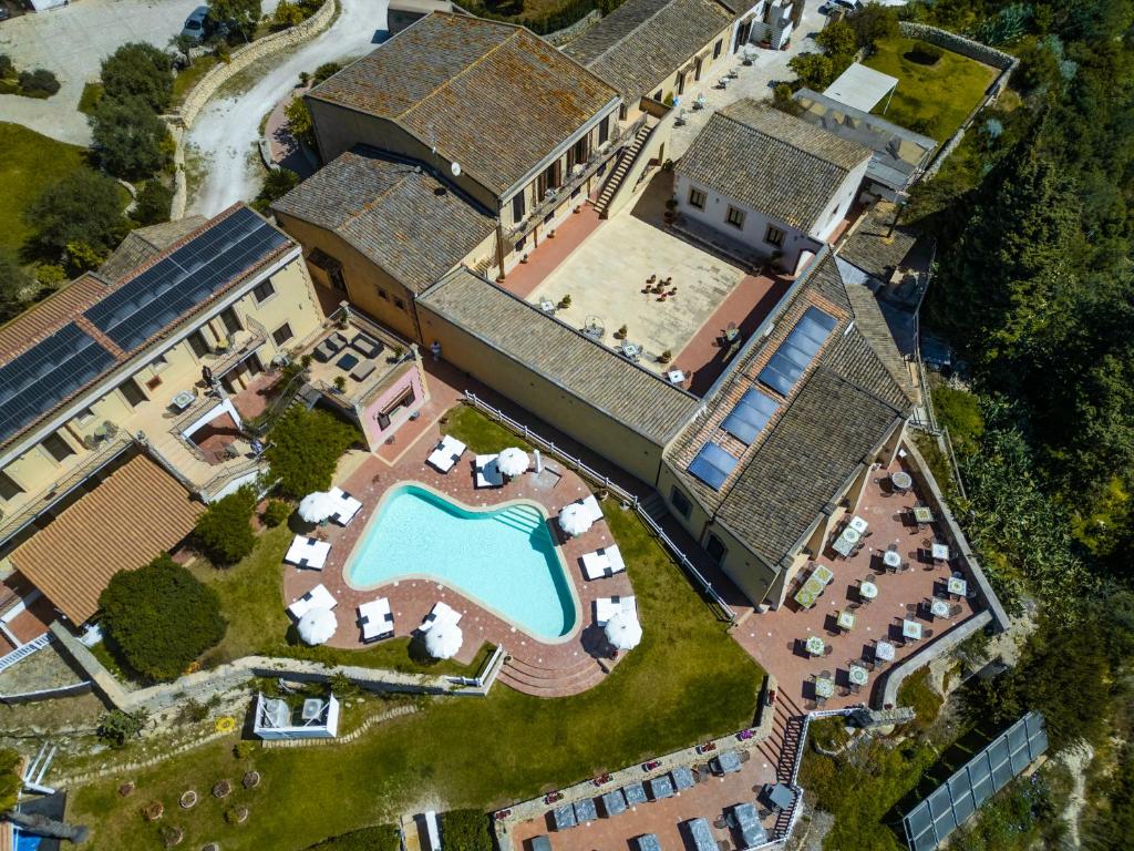 an aerial view of a house with a swimming pool at Hotel La Corte Del Sole in Noto