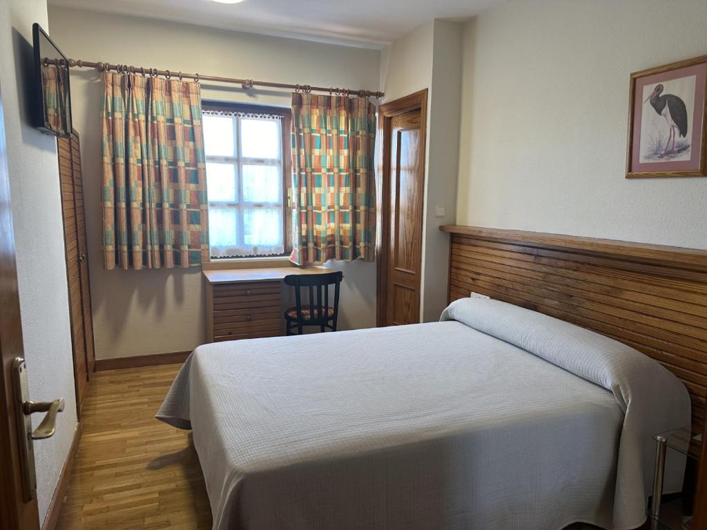 Postel nebo postele na pokoji v ubytování Hosteria Gelin de Gajano